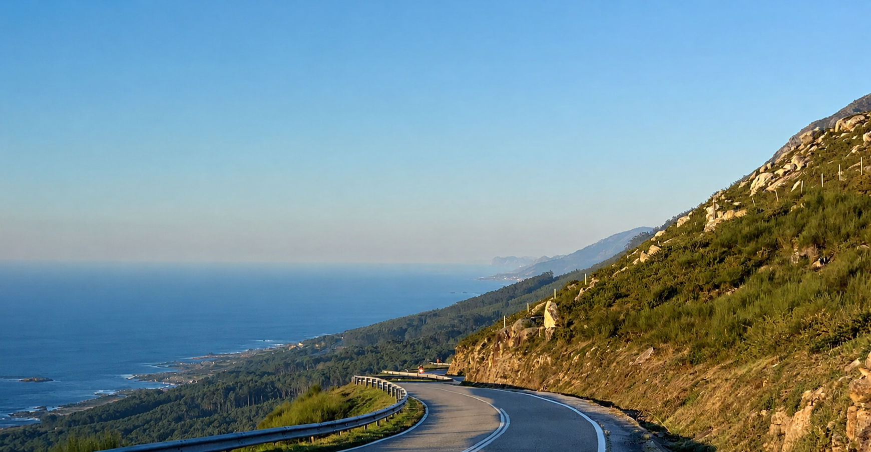 A road curving through the Portuguese Atlantic landscape